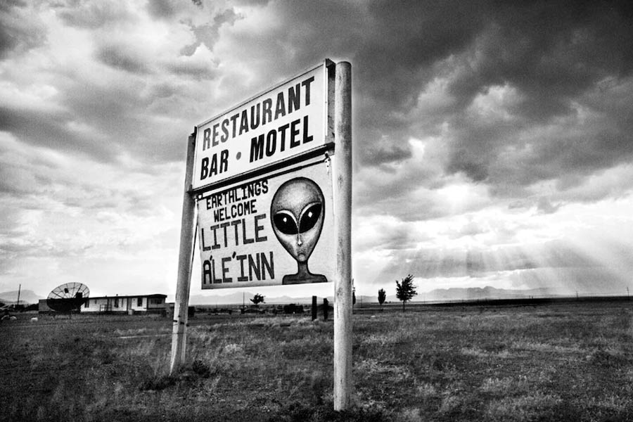 Sign board of People welcomes an alien 