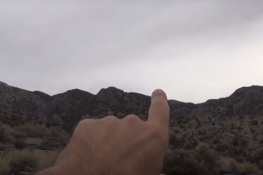 Kenney Veach pointing at the location of M Cave