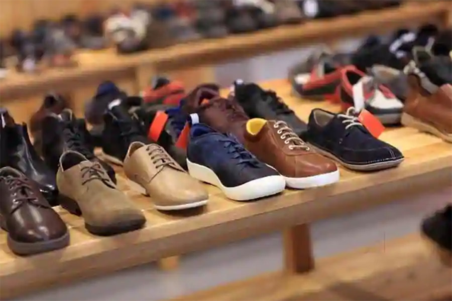 Different types of shoes racked in a shop