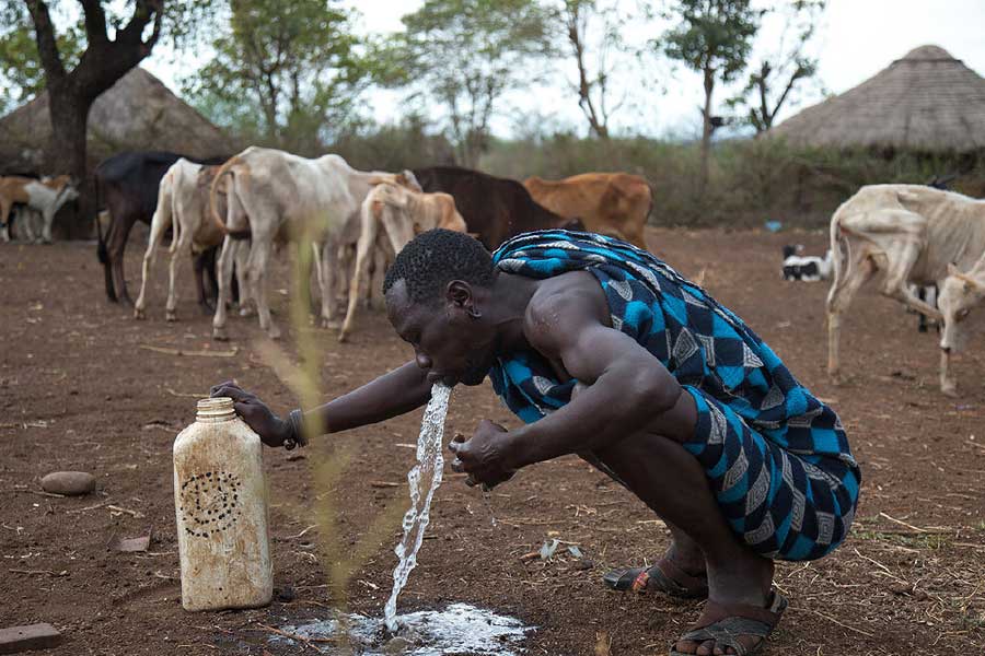 Bodi tribe male vomiting