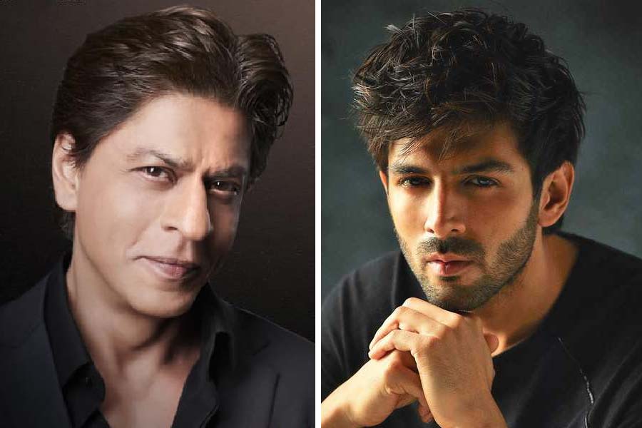 Photograph of Bollywood Actors Shah Rukh Khan and Kartik Aaryan