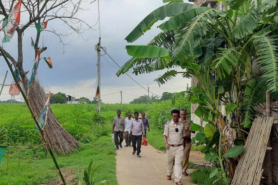 TMC workers returning home from hiding at Ghatal