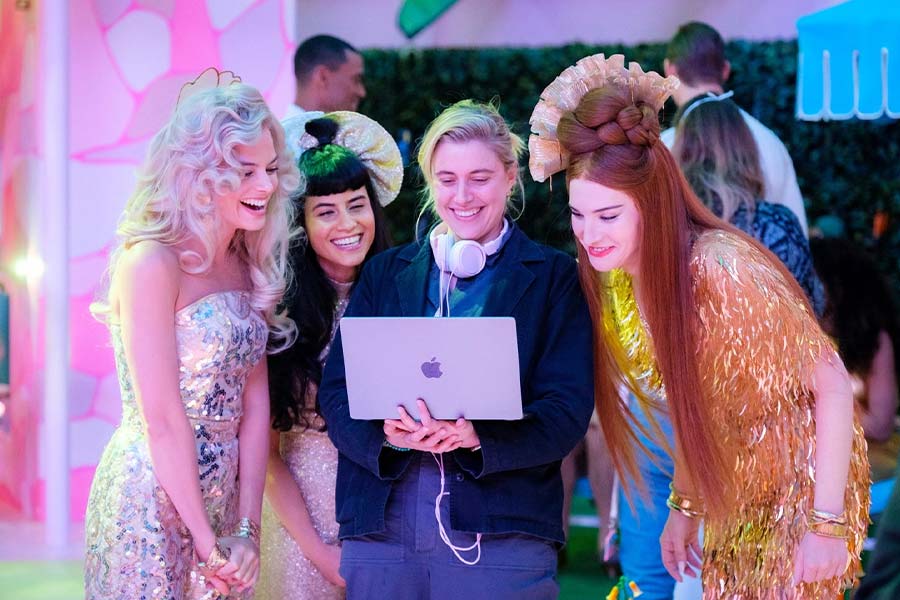 Greta Gerwig with the Barbies.