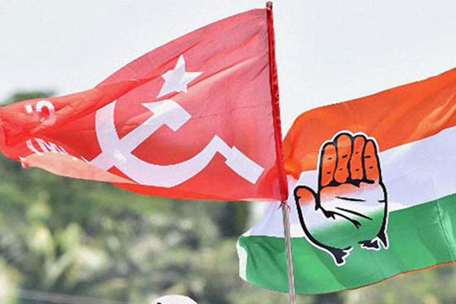 An image of CPM and Congress Flags