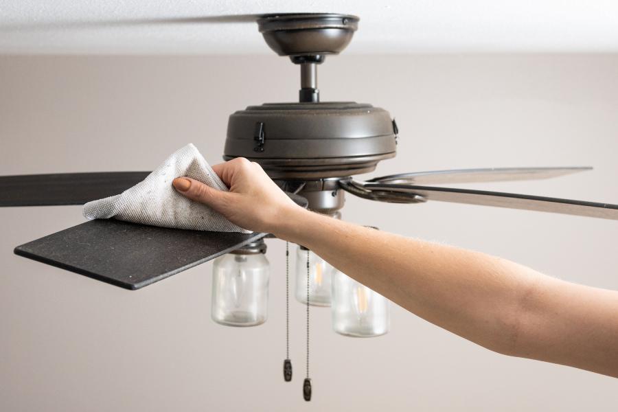 Image of ceiling fan cleaning.