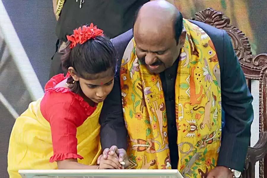 Image of C V Ananda Bose and kid.