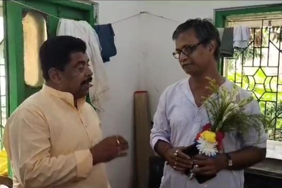 TMC Candidate gifted confectionary and flower to opposition leaders