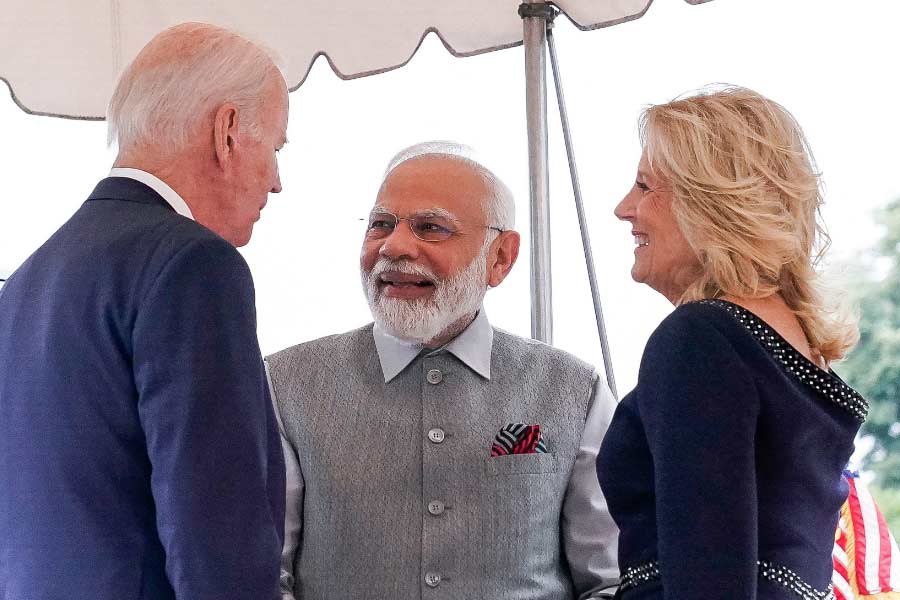 Image of Joe Biden, Narendra Modi and Jill Biden.