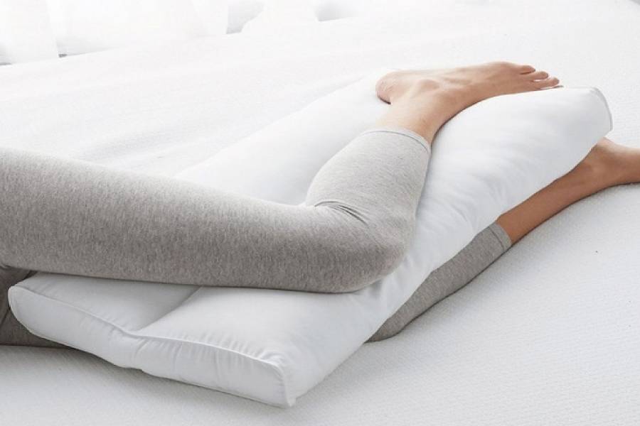 Image of Sleeping with a pillow Between Knees.