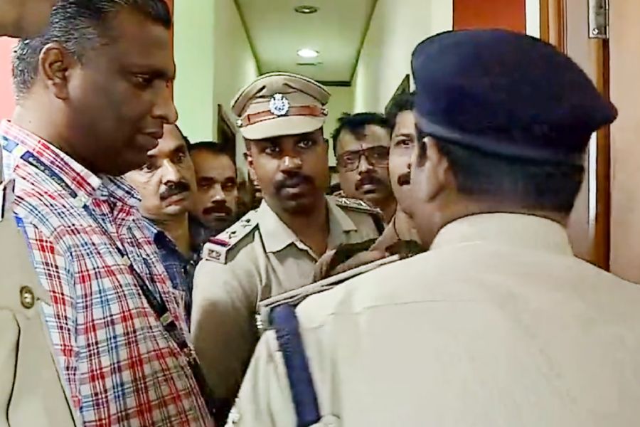A police  team searches Asianet news channel office.