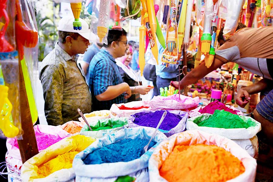 A Photograph of people buying colours for Holi