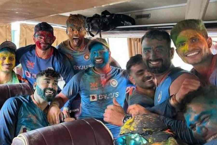 Picture of Indian cricketers celebrating Holi in team bus