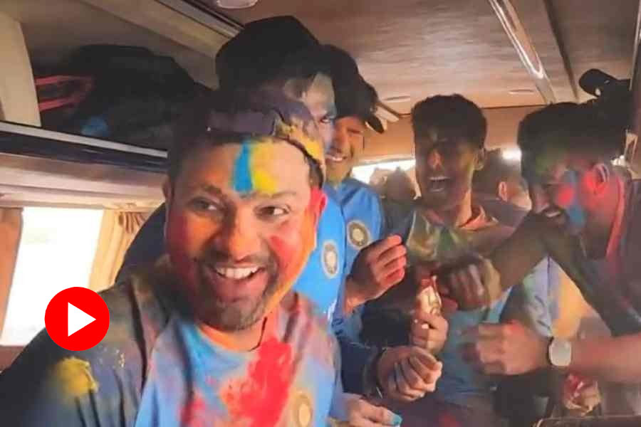 Indian cricketers celebrating holi in team bus