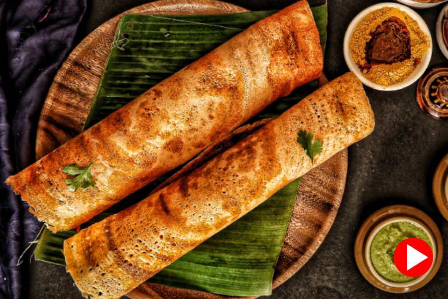 student cooks dosa during lecture 