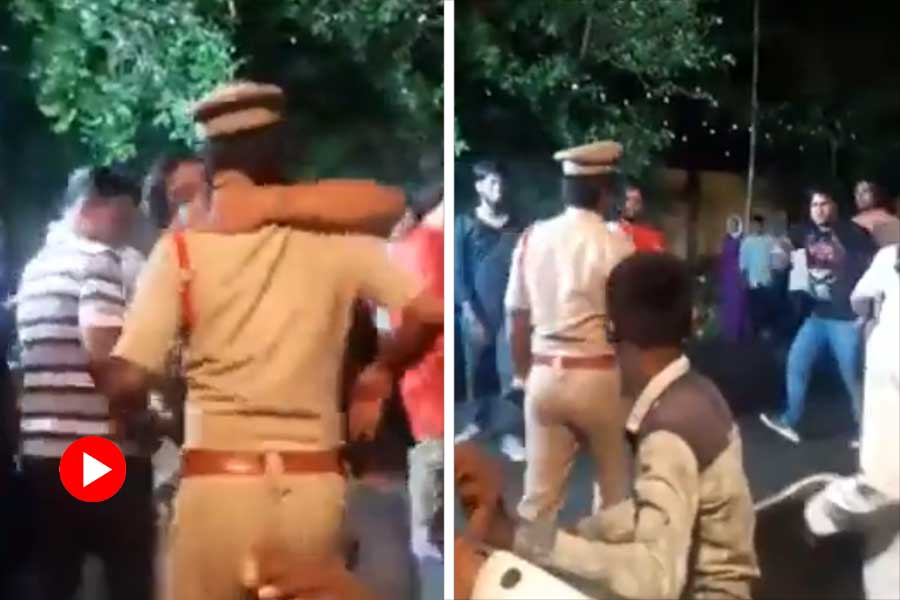 Drunk man kisses cop while dancing in Baraat.
