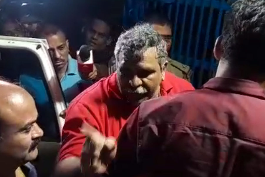 Police brings arrested BJP leader Jitendra Tiwari in Asansol in the late hours of Saturday.