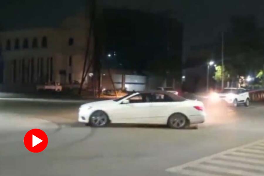 Viral Video of man doing stunt with expensive car in the middle of the road.
