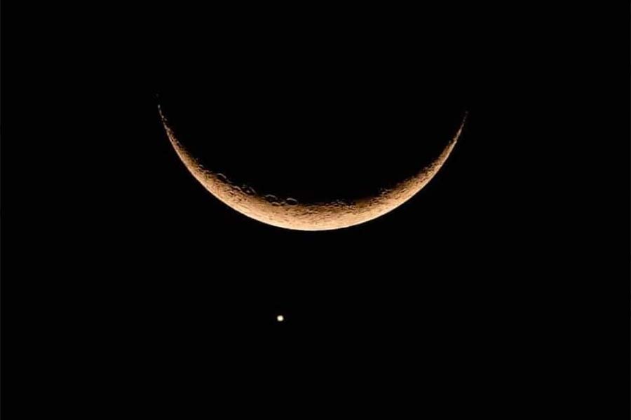 Planet Venus disappears behind the Moon in a rare conjunction
