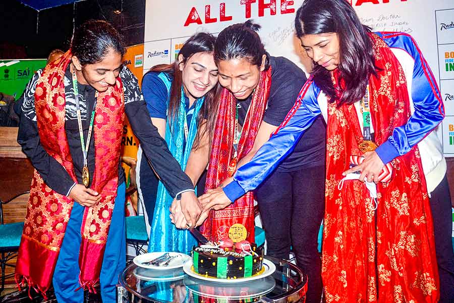 A Photograph of Indian Women Boxers celebrating their victory in the World Boxing Championship 