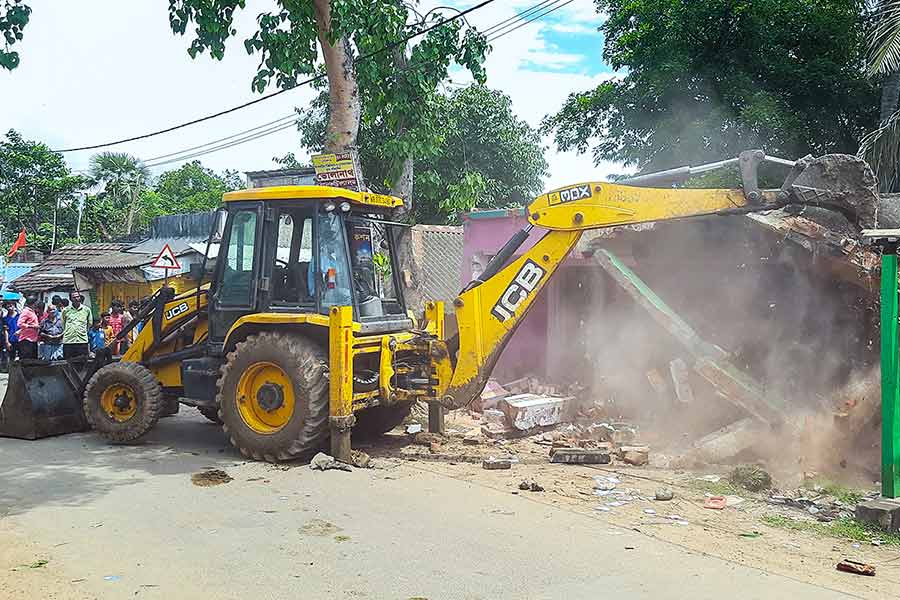 JCB demolishing a illegal construction