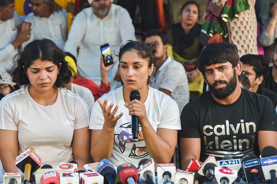 Image of Wrestlers Bajrang Punia, Vinesh Phogat and Sakshi Malik while addressing the media during their ongoing protest at Jantar Mantar in Delhi