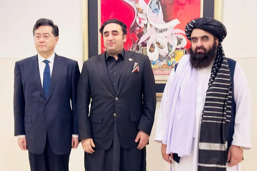 image of China and Pakistan\'s Foreign Minister and Afghan Taliban representative.  