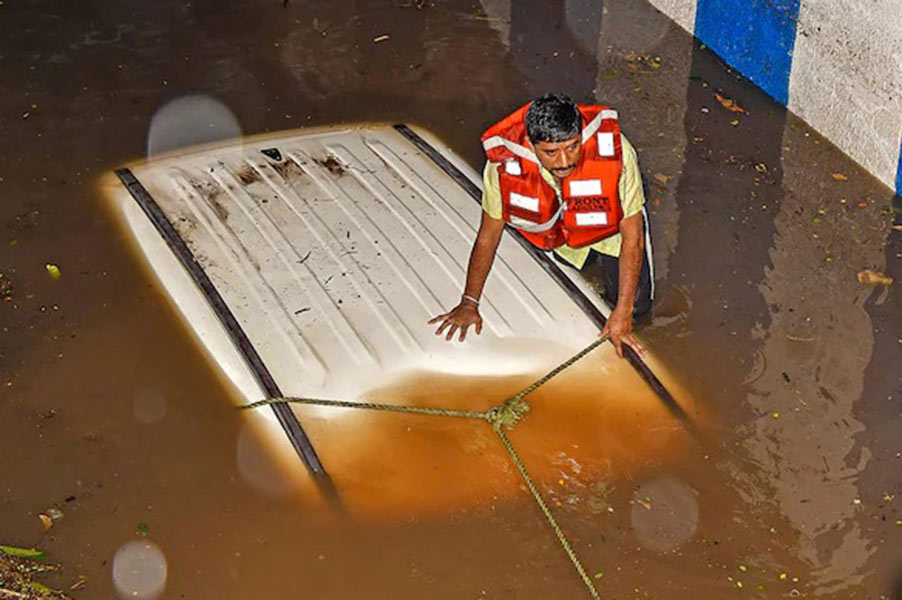 Woman dies after his car got stuck in flooded underpass in Bengaluru.