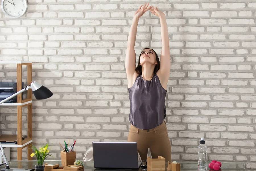 Five yoga poses for desk workers.