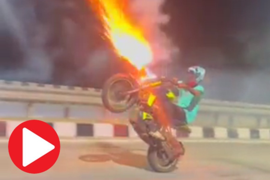 Man performs bike stunt with firecrackers attached