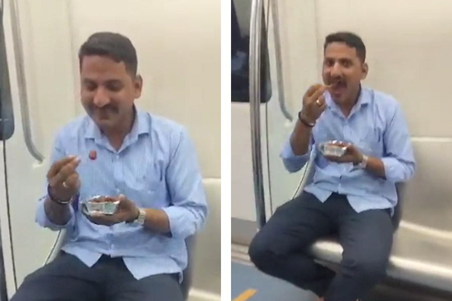 image of man eating in metro