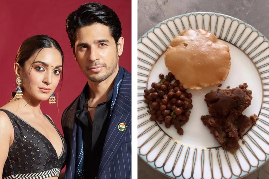 Bollywood Actor Kiara Advani and Sidharth Malhotra in traditional attire having Ashtami Bhog together.