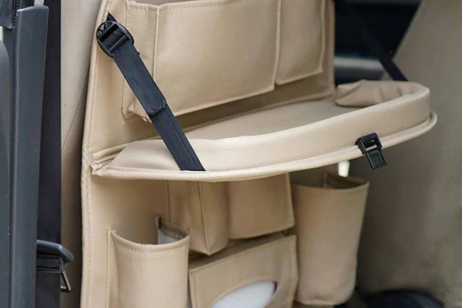 গাড়ির ভিতর অনেক কিছু রাখার প্রয়োজন পড়ে।  যেমন নিত্য প্রয়োজনীয় জিনিসপত্র আবার হঠাৎ করে দরকার পড়তে পারে এমন অনেক কিছুও সঙ্গে রাখতে হয়। সব কিছু ড্যাশ বোর্ডের কাছে ড্রয়ারে রাখার জায়গা হয় না। তাই গাড়িতে সিটের পিছনে লাগিয়ে রাখুন অর্গানাইজার পাউচ। এতে আপনি আলাদা আলাদাভাবে নানা ধরনের জিনিস গুছিয়ে রাখতে পারবেন।