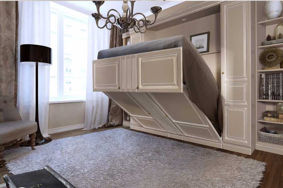 দেওয়াল খাট: খাটের জায়গা কমে গেলেই যেন ঘরে অনেকখানি জায়গা বেরিয়ে আসে। তাই করিয়ে নিতে পারেন দেওয়াল খাট। সকালে ঘুম থেকে উঠে দেওয়ালে তুলে দিলেই পুরো ফাকা হয়ে যাবে আপনার ঘরের মেঝে। 