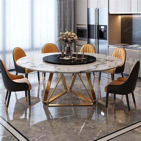 ১১. পাথরের উপরি ভাগ - অভিজাত বাড়িতে পাতার জন্য আদর্শ ডাইনিং টেবিল। কাঠের ফ্রেমের উপর চকচকে পাথরের টপ। সঙ্গে চেয়ার,  ধাতবের।