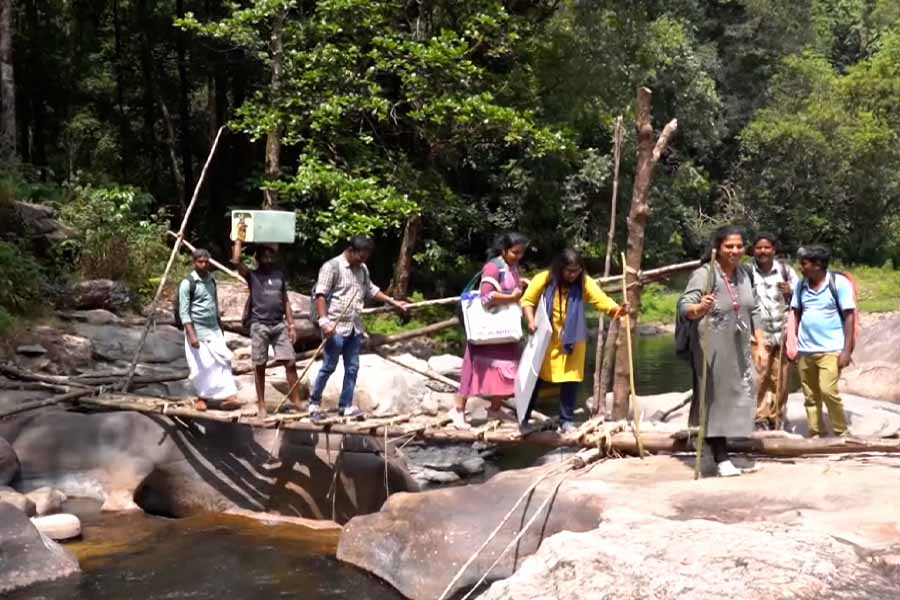 Poll officials in Kerala trek 18 km in dense forest to register 92 years old bedridden man's vote in Lok Sabha Elections 2024 dgtl