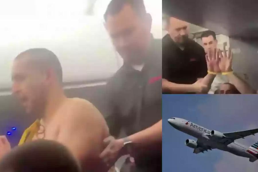 American man arrested after tries to open plane doors