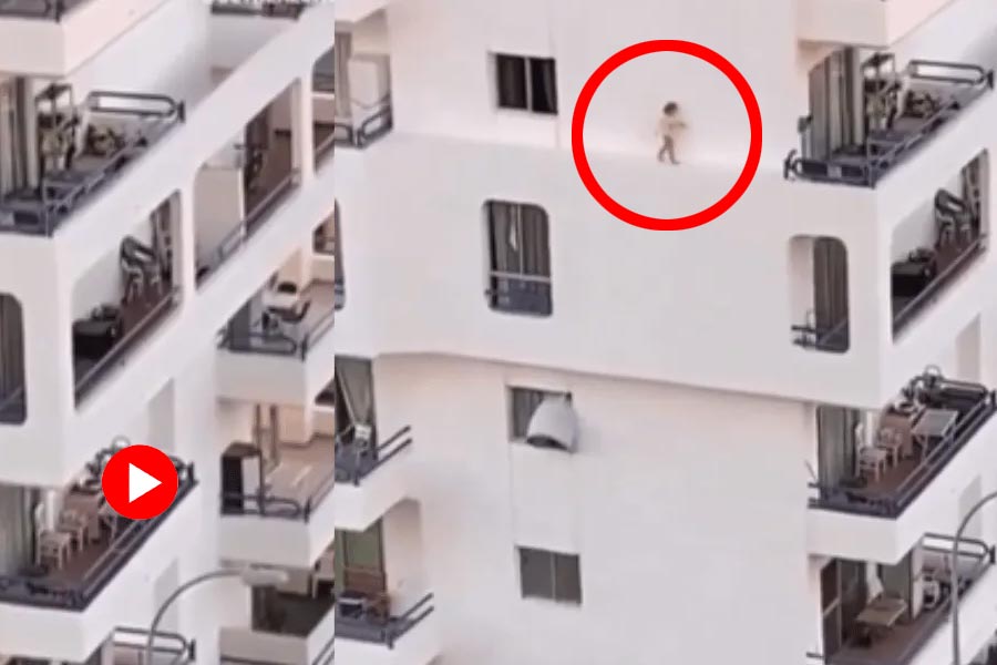 Viral Video of toddler walking on a multi storey building