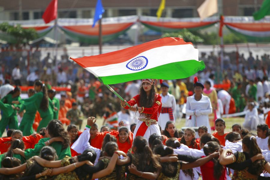 student holding national flag.