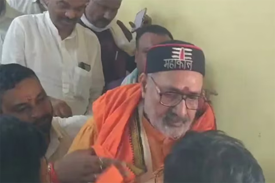 A man tries to punch minister Giriraj Singh during a public event in Bihar