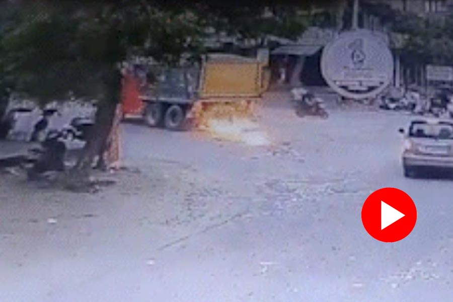 CCTV footage showed truck hitting bike before running over it