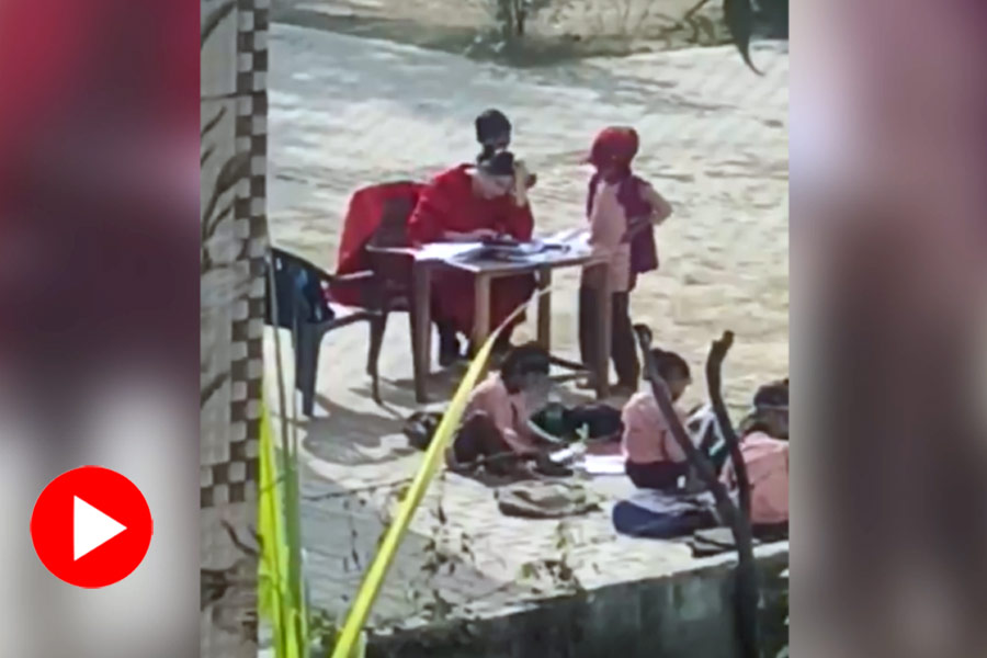 Video of a female teacher of a UP govt school receiving massages from students goes viral