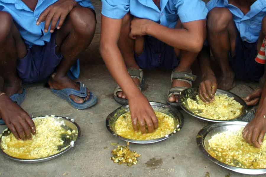 How can the successful implementation of nutritious food delivery system be achieved if the mid-day meal allocation is kept to a minimum in the current market situation