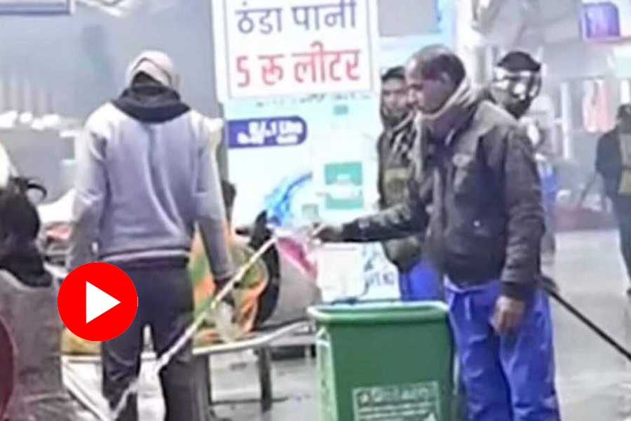 A viral video shows platform cleaners spraying water on people sleeping on the floor