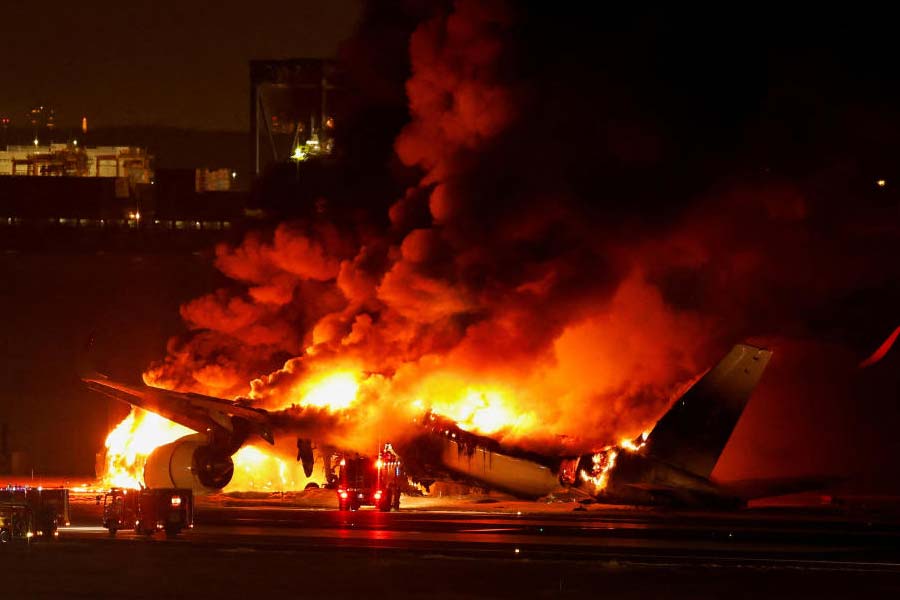 Image of the burning plane in haneda airport in tokyo