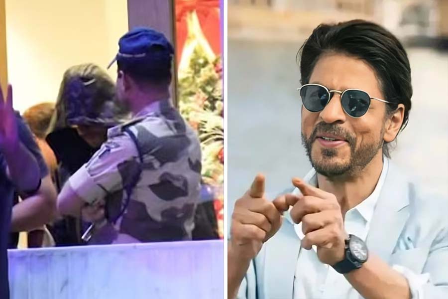 Shah Rukh Khan hides his face with hoodie as he returns from New Year holiday with family