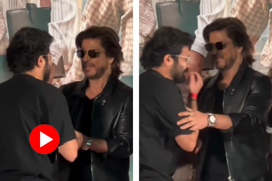 Shah Rukh Khan’s fan breaks down as star kisses him on forehead.