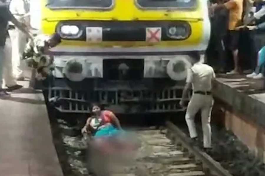 Mumbai woman survives after local train runs over her