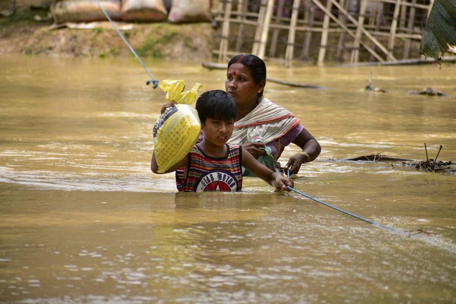 অসমে বন্যাকবলিত জনজীবন।