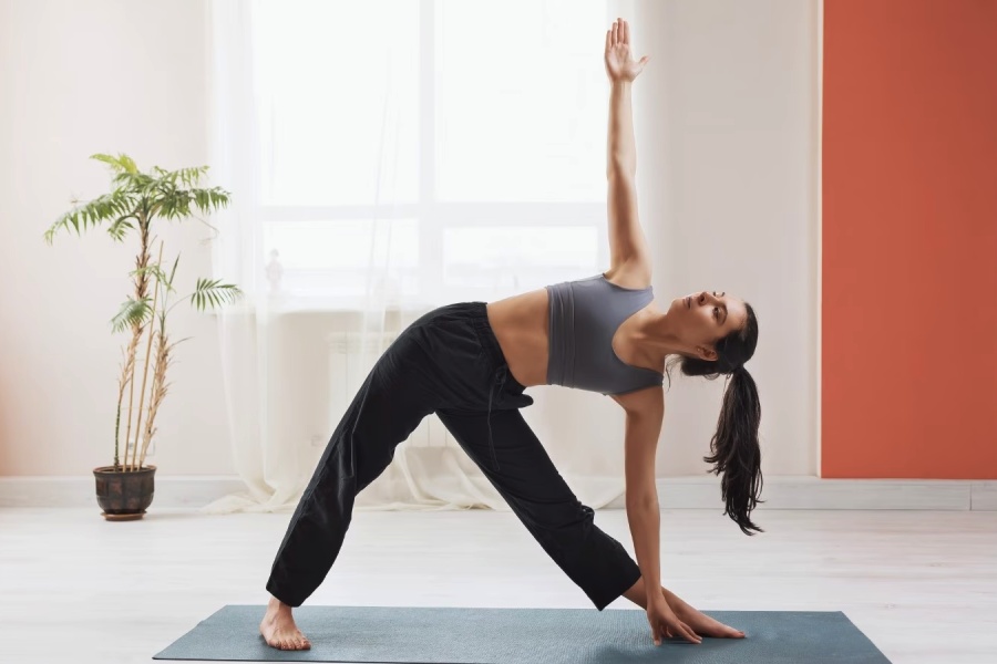 Learn Trikonasana step-by-step and strengthen knees thighs and ankles