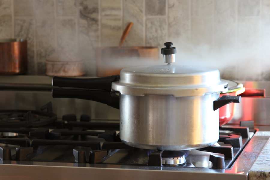 How many whistles do you need to cook staples in a pressure cooker
